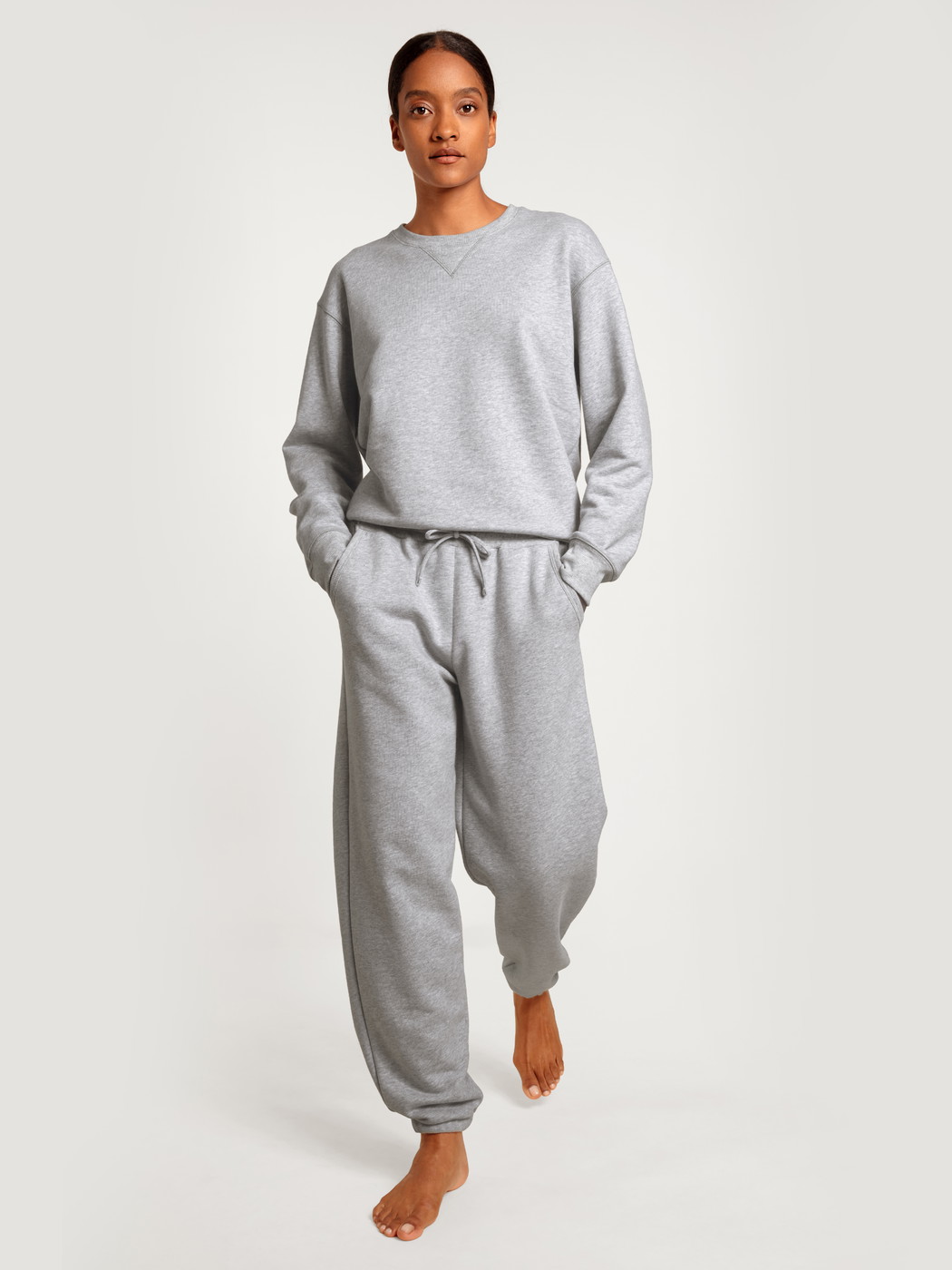 Women model is wearing Sweatshirt made of 100% Cotton in Grey, Unicoloured from the Circular Lounge series by CALIDA, Front view, Outfit