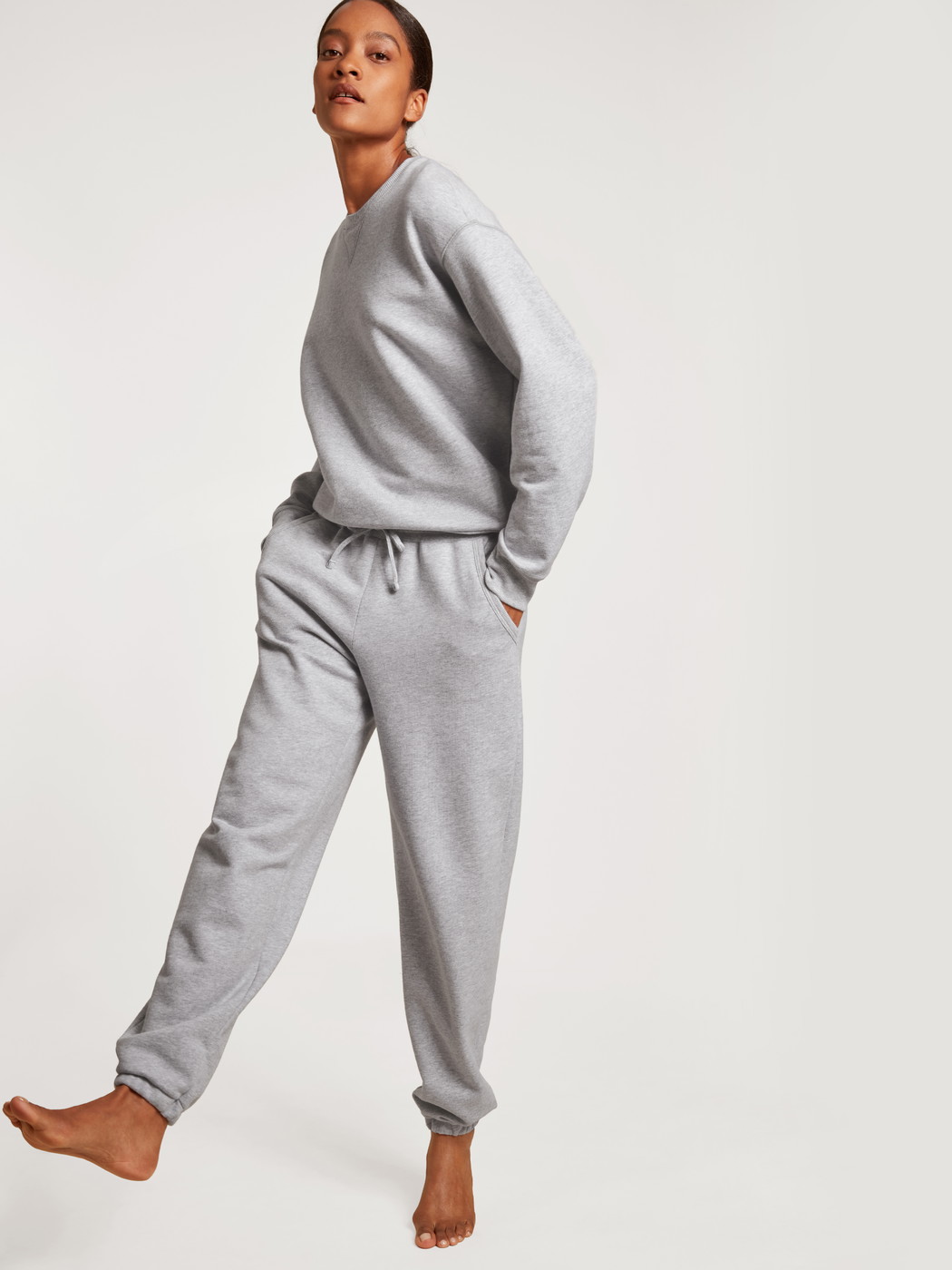 Women model is wearing Sweatshirt made of 100% Cotton in Grey, Unicoloured from the Circular Lounge series by CALIDA