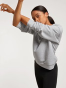 Women model is wearing Sweatshirt made of 100% Cotton in Grey, Unicoloured from the Circular Lounge series by CALIDA