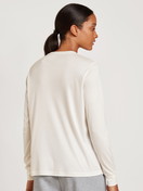 Women model is wearing Long-sleeved shirt made of Modal in White, Unicoloured from the Lounge & Relax series by CALIDA, Back view