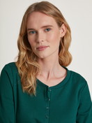 Women model is wearing Shirt long-sleeve made of 100% Cotton in Green, Unicoloured from the Favourites Holidays series by CALIDA