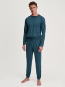 La modella / Il modello Uomo indossa Shirt a manica lunga in TENCEL™ di colore Turchese, Tinta unita, della serie DSW Warming di CALIDA, Abbigliamento