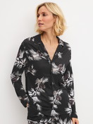 Women model is wearing Long Sleeve Shirt with Buttons – TENCEL™ Modal and Silk Blend made of Modal in Black, Floral from the Glimmer M&M series by CALIDA, Front view