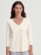 Women model is wearing Shirt 3/4 sleeve made of 100% Cotton in Beige, Unicoloured from the Favourites Botanic series by CALIDA, Front view