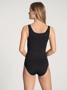 Women model is wearing Bodysuit made of Cotton in Black, Unicoloured from the Natural Comfort series by CALIDA, Back view