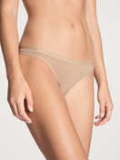 Women model is wearing String made of Cotton in Beige, Unicoloured from the Natural Comfort series by CALIDA, Front view