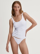 Women model is wearing Low Cut Tanga Brief made of Polyamide in White, Unicoloured from the Sleek Skin series by CALIDA, Outfit