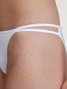 Women model is wearing Low Cut Tanga Brief made of Polyamide in White, Unicoloured from the Sleek Skin series by CALIDA, Detail