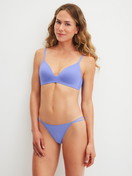 Women model is wearing Low Cut Tanga Brief made of Polyamide in Blue, Unicoloured from the Sleek Skin series by CALIDA, Outfit