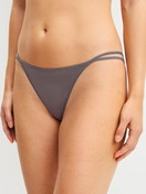 Women model is wearing Low Cut Tanga Brief made of Polyamide in Brown, Unicoloured from the Sleek Skin series by CALIDA, Front view