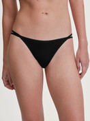 Women model is wearing Low Cut Tanga Brief made of Polyamide in Black, Unicoloured from the Sleek Skin series by CALIDA, Front view