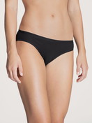 Women model is wearing Brief made of Cotton in Black, Unicoloured from the Natural Comfort series by CALIDA, Front view