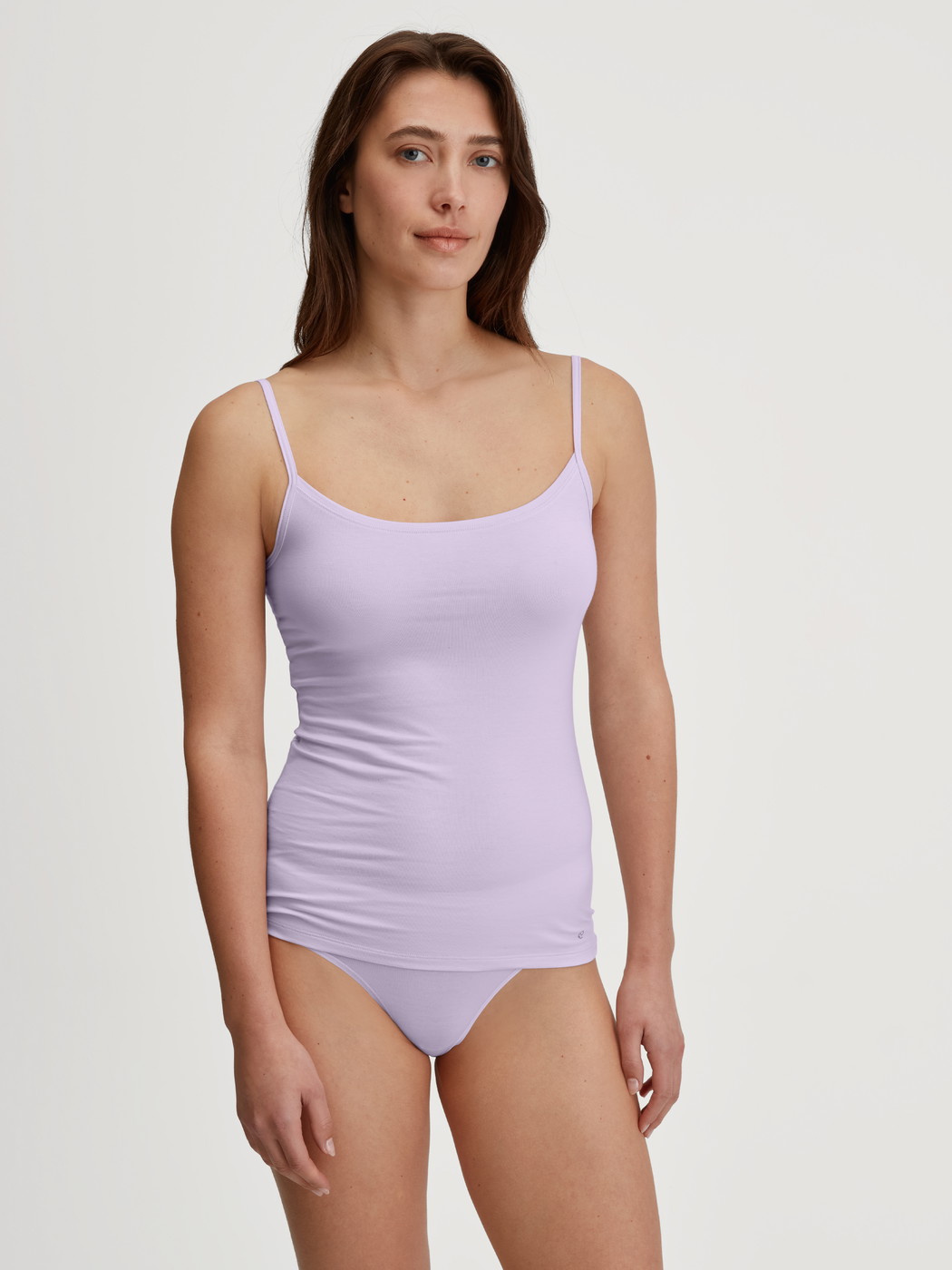 Women model is wearing Brief, regular cut made of Cotton in Purple, Unicoloured from the Natural Comfort series by CALIDA, Outfit