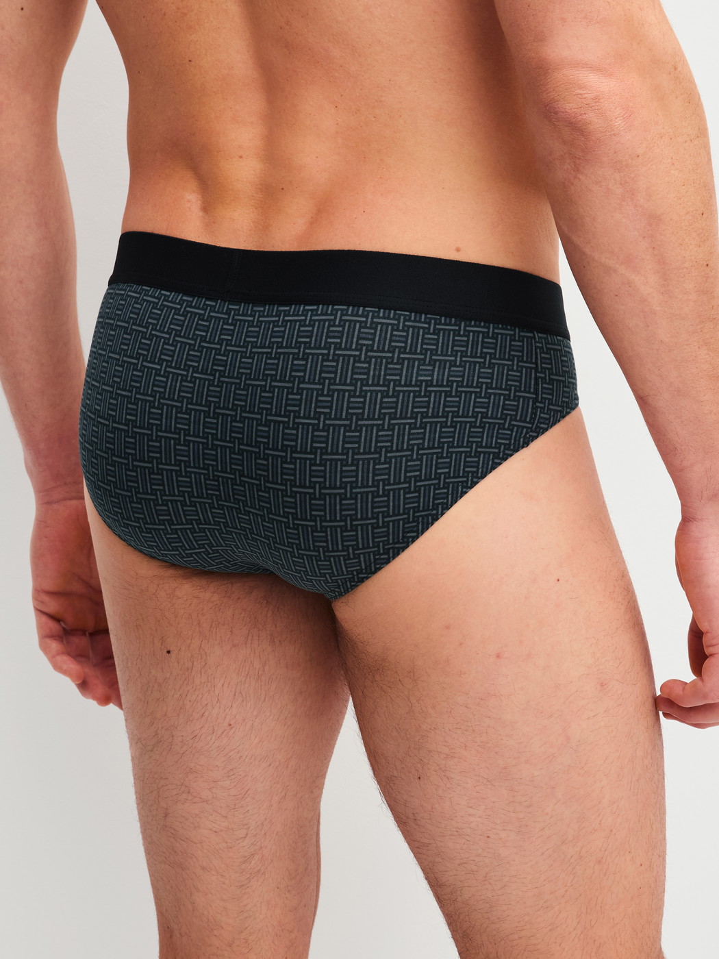 Men model is wearing Brief made of Cotton in Black, Patterned from the Cotton Code Design series by CALIDA, Back view