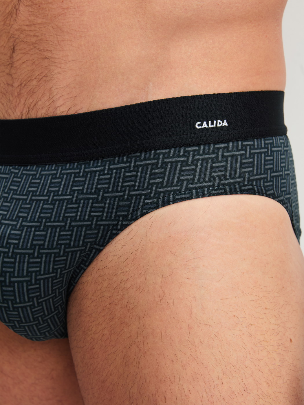 Men model is wearing Brief made of Cotton in Black, Patterned from the Cotton Code Design series by CALIDA, Detail