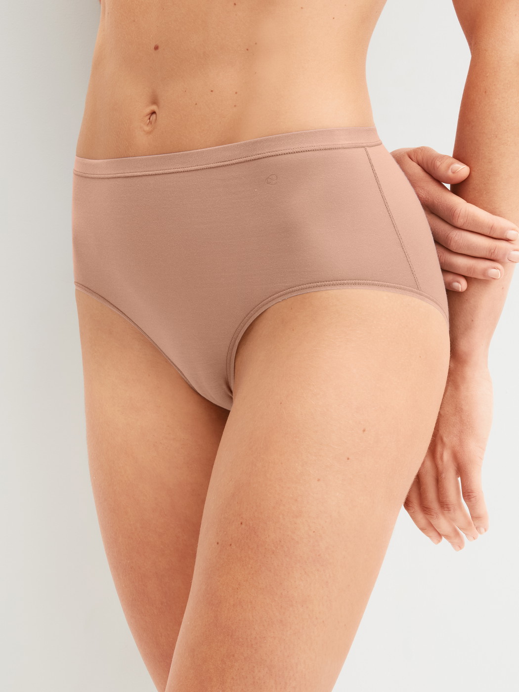 Women model is wearing Brief made of Cotton in Brown, Unicoloured from the Natural Comfort series by CALIDA, Front view