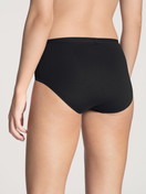 Women model is wearing Brief made of Cotton in Black, Unicoloured from the Natural Comfort series by CALIDA, Back view