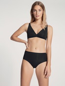 Women model is wearing Brief made of Cotton in Black, Unicoloured from the Natural Comfort series by CALIDA, Outfit, Front view