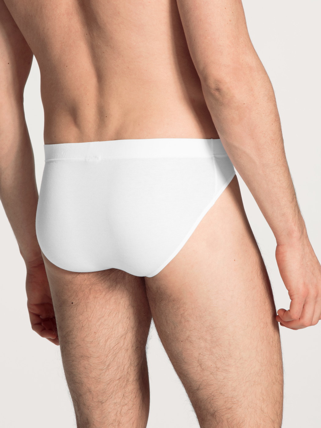 Le mannequin Homme porte le/la Mini slip en Coton de couleur Blanc, Unicolore, de la série Evolution de CALIDA, Vue arrière
