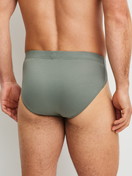 La modella / Il modello Uomo indossa Mini slip in Cotone di colore Verde, Tinta unita, della serie Evolution di CALIDA, Vista posteriore