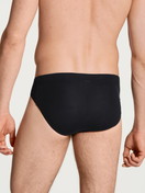 La modella / Il modello Uomo indossa Mini slip in Cotone di colore Nero, Tinta unita, della serie Evolution di CALIDA, Vista posteriore