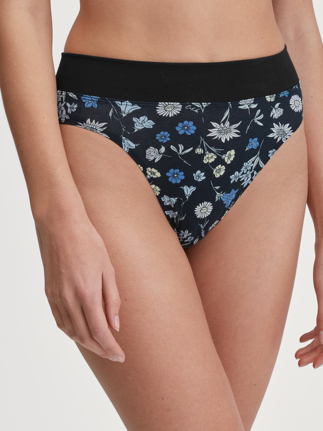 Women model is wearing Brief, high waist made of Cotton in Black, Floral from the Elastic Trend series by CALIDA, Front view