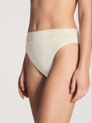 Women model is wearing Brief made of 100% Cotton in Beige, Lace from the Iconics series by CALIDA, Front view