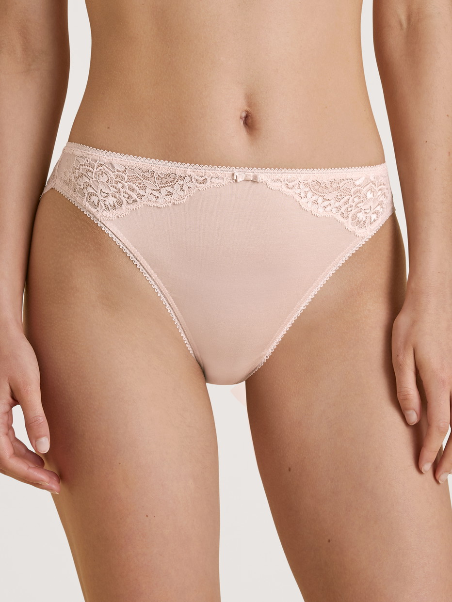Women model is wearing Brief, regular cut made of Viscose in Pink, Lace from the Sensual Secrets series by CALIDA, Front view