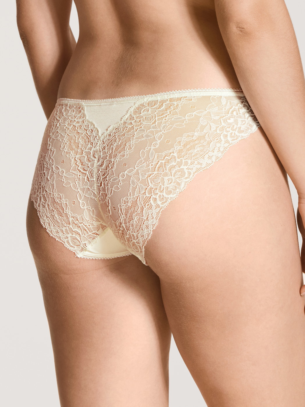 Women model is wearing Brief, regular cut made of Viscose in Beige, Lace from the Sensual Secrets series by CALIDA, Back view