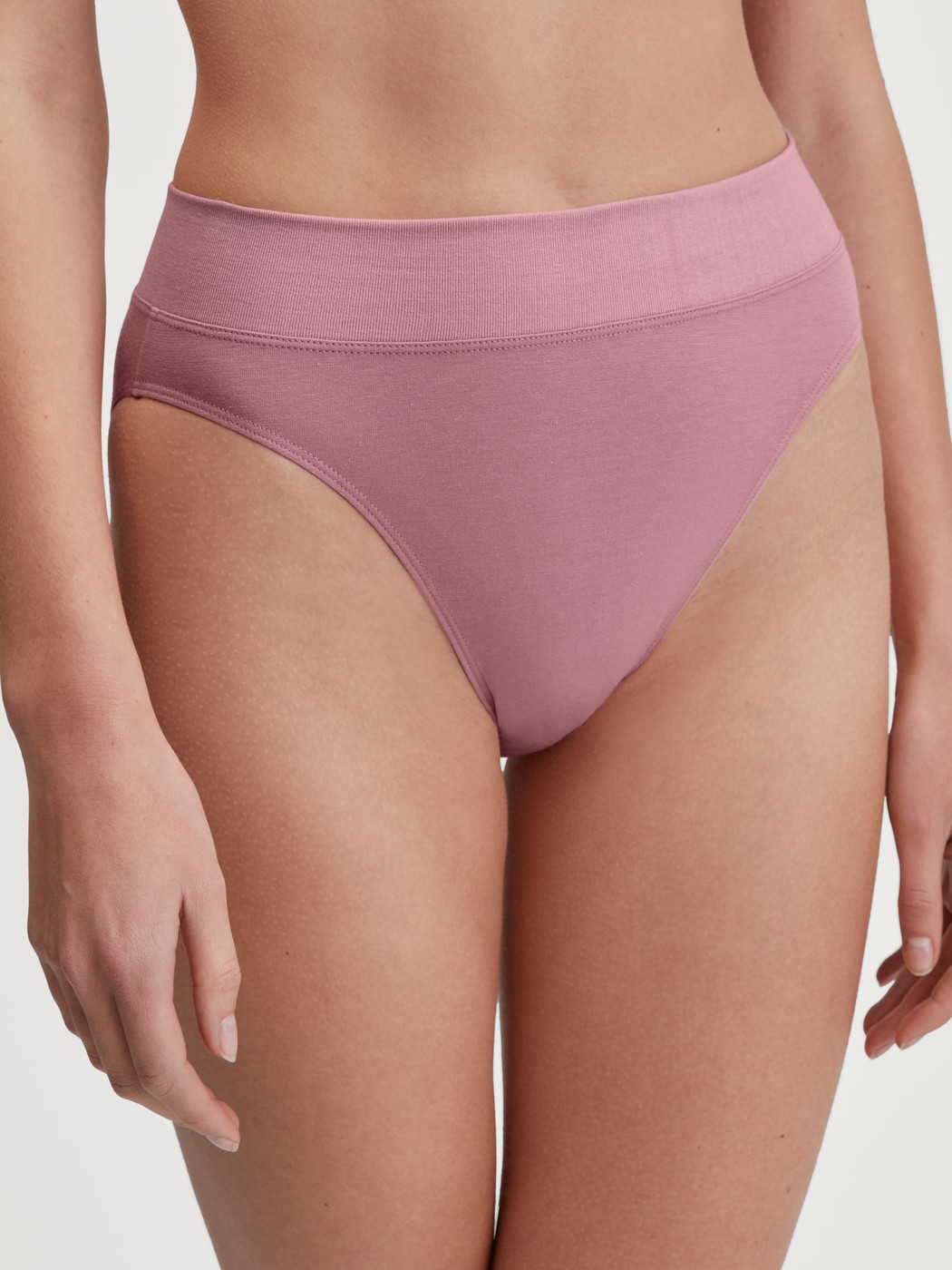 Women model is wearing Brief, high waist made of Cotton in Pink, Unicoloured from the Elastic series by CALIDA, Front view