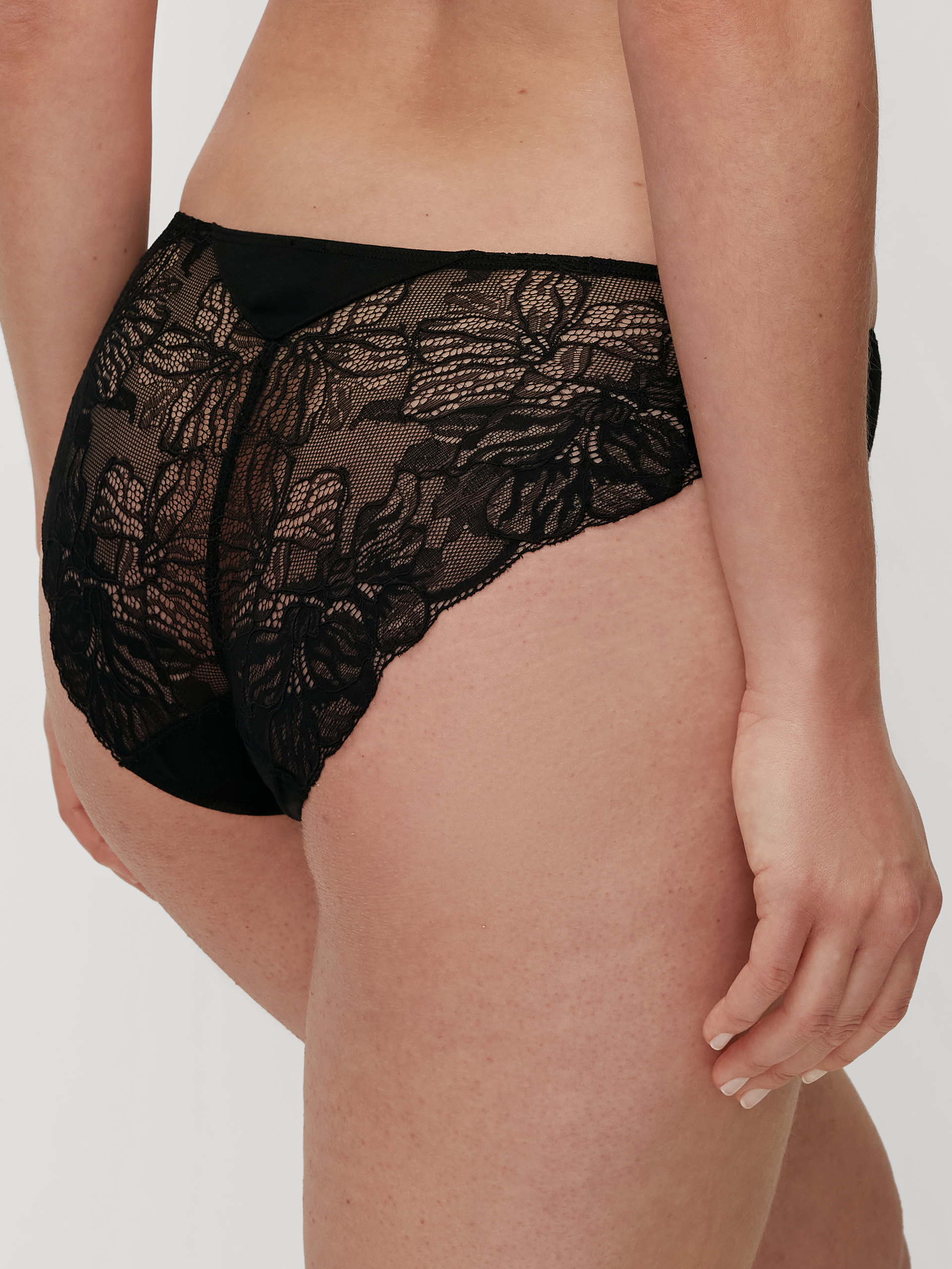 Women model is wearing Brief, regular cut made of Modal in Black, Lace from the Seduction Lace series by CALIDA, Back view