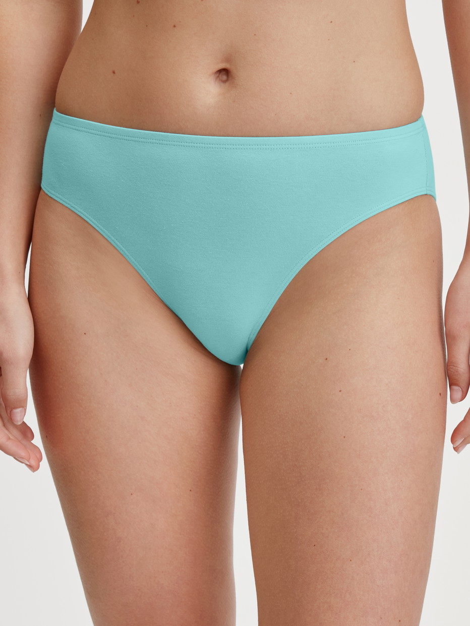 Women model is wearing Slip, regular cut made of Cotton in Turquoise, Unicoloured from the Nat. Comfort Xtra series by CALIDA, Front view