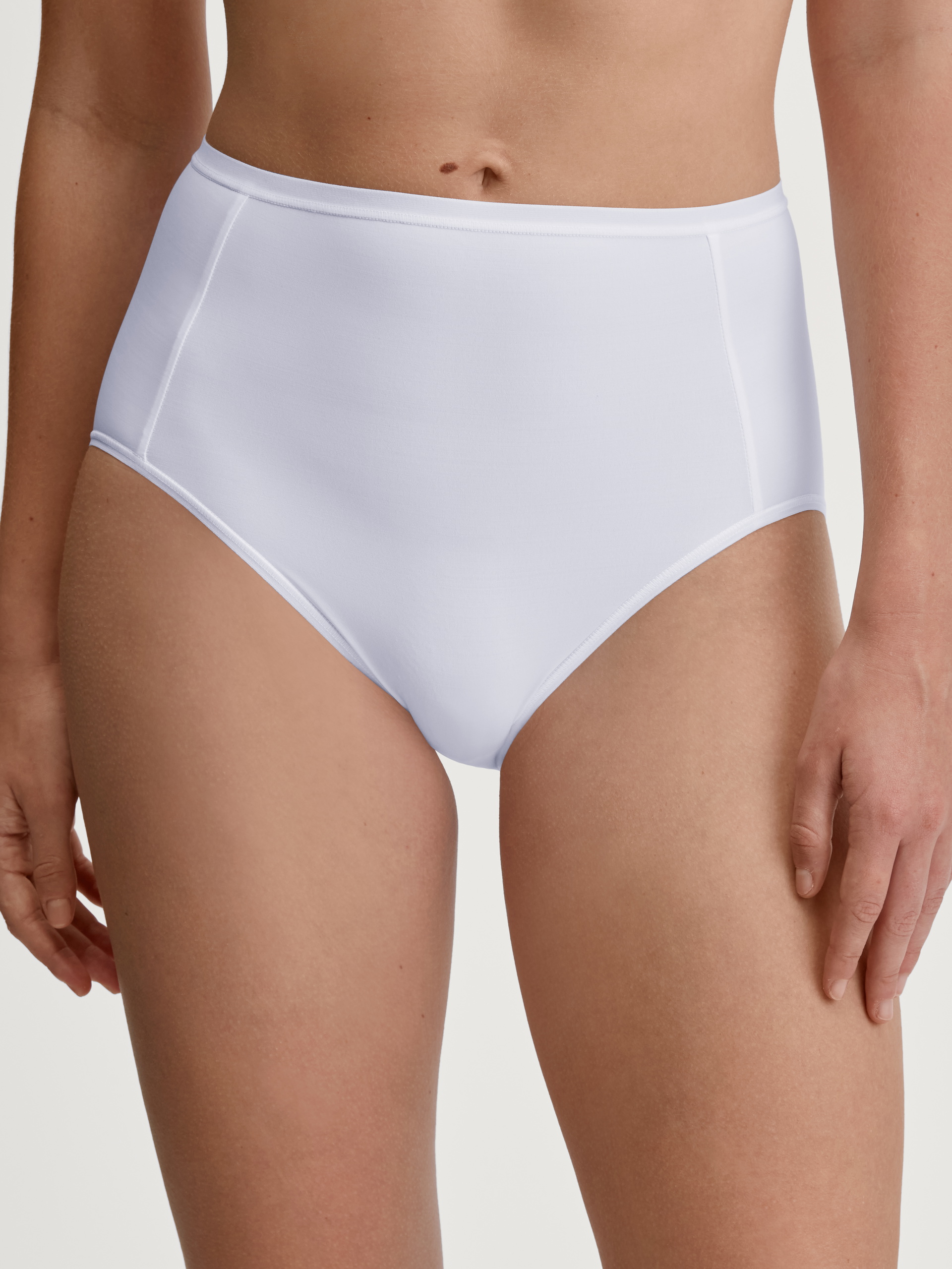 Women model is wearing Brief, high waist made of Polyamide in White, Unicoloured from the Sleek Skin series by CALIDA, Front view