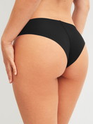 Women model is wearing Seamless Brazilian Brief made of Modal in Black, Unicoloured from the Natural Skin series by CALIDA, Back view