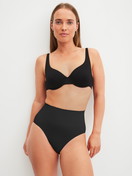 Women model is wearing Shapewear brief made of Polyamide in Black, Unicoloured from the Seamless Shape series by CALIDA, Outfit