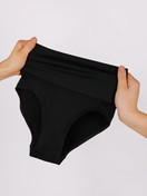 Women model is wearing Shapewear brief made of Polyamide in Black, Unicoloured from the Seamless Shape series by CALIDA, Additional Image