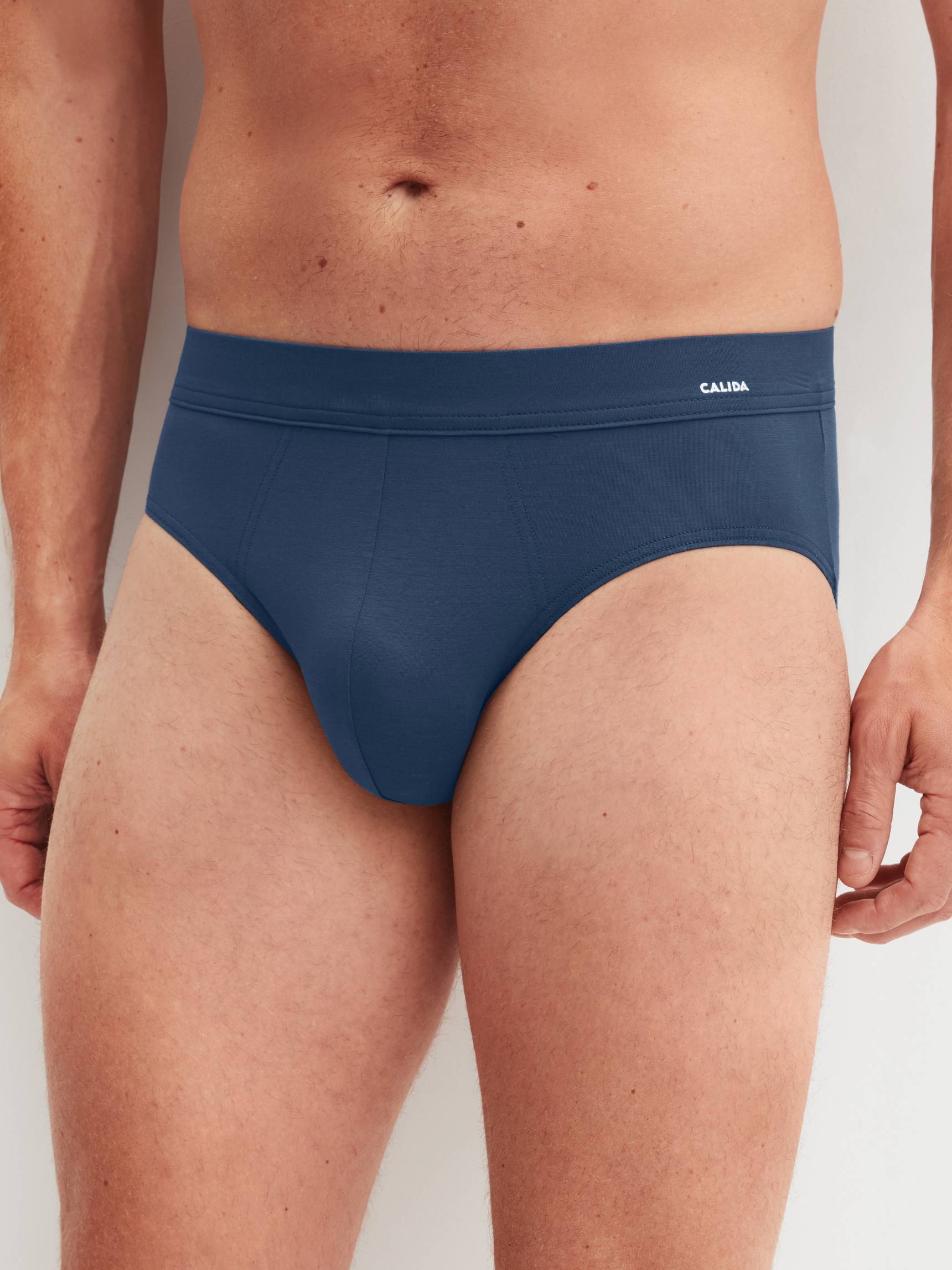 Men model is wearing Slip made of Modal in Blue, Unicoloured from the Balanced Day series by CALIDA, Front view