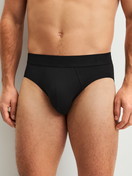 Men model is wearing Brief made of Modal in Black, Unicoloured from the Clean Line series by CALIDA, Front view