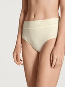 Women model is wearing Midi brief made of 100% Cotton in Beige, Lace from the Iconics series by CALIDA, Front view
