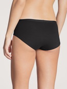 Le mannequin Femme porte le/la Panty, taille basse en Coton de couleur Noir, Unicolore, de la série Natural Comfort de CALIDA, Vue arrière