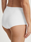 Women model is wearing Shorty regular cut made of Cotton in White, Unicoloured from the Elastic Special series by CALIDA, Back view