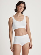 Women model is wearing Shorty regular cut made of Cotton in White, Unicoloured from the Elastic Special series by CALIDA, Outfit
