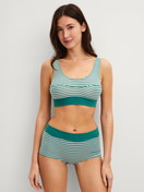 Women model is wearing Shorty regular cut made of Cotton in Green, Striped from the Elastic Special series by CALIDA, Outfit