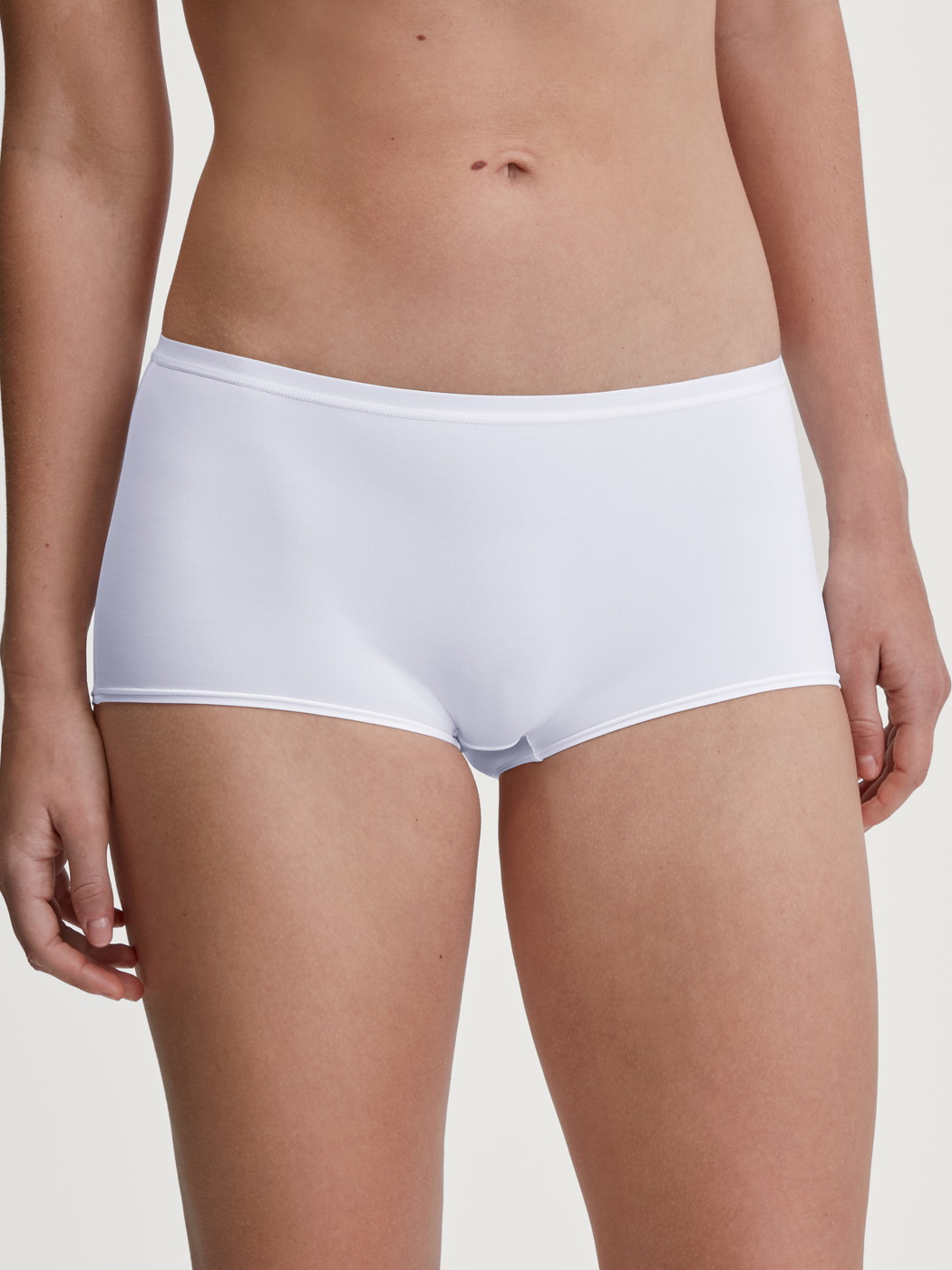 Women model is wearing Shorty regular cut made of Polyamide in White, Unicoloured from the Sleek Skin series by CALIDA, Front view