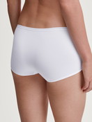 Women model is wearing Shorty regular cut made of Polyamide in White, Unicoloured from the Sleek Skin series by CALIDA, Back view