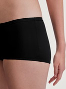 Women model is wearing Shorty regular cut made of Polyamide in Black, Unicoloured from the Sleek Skin series by CALIDA, Detail