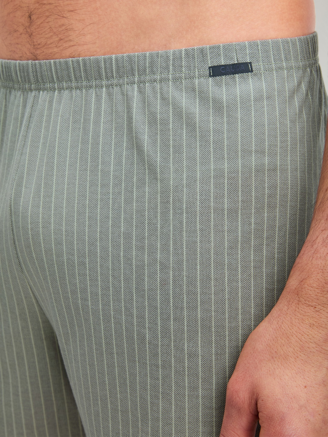 Men model is wearing Boxer shorts made of 100% Cotton in Green, Striped from the Prints series by CALIDA, Detail