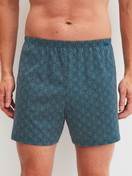 Le mannequin Homme porte le/la Boxer short en Coton de couleur Bleu, À motifs, de la série Prints de CALIDA, Vue de face