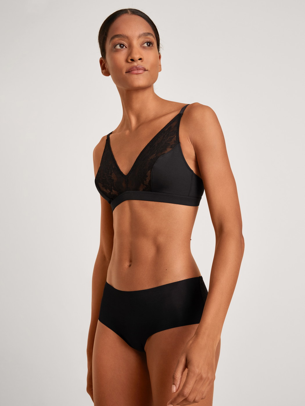 Women model is wearing Panty made of Modal in Black, Lace from the Natural Skin Lace series by CALIDA, Front view, Outfit