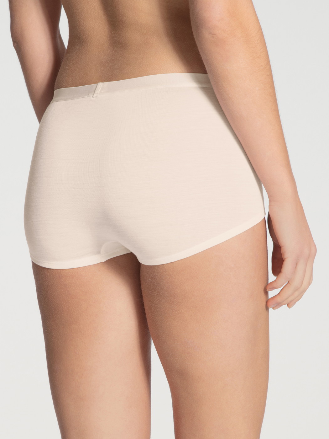 Women model is wearing Panty, high waist made of Swiss+Cotton in Beige, Unicoloured from the True Confidence series by CALIDA, Back view